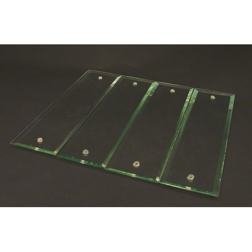 171 - A set of four early 20thC glass door finger plates, with bevelled edges, each 11