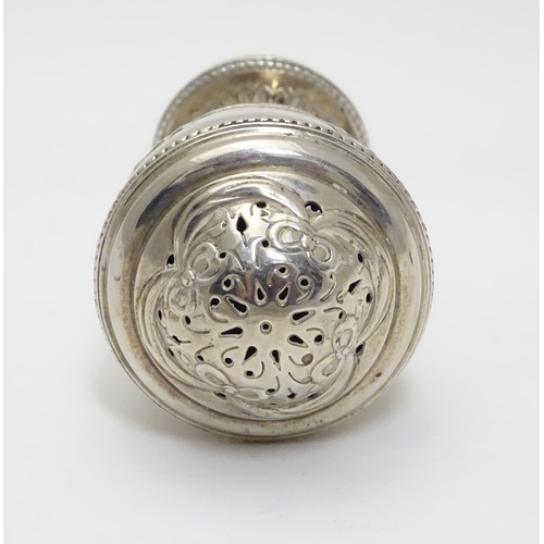 190 - A Geo IV silver pepperette of urn form. Hallmarked London 1823 maker J.A.  3 1/2