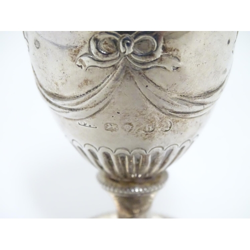 190 - A Geo IV silver pepperette of urn form. Hallmarked London 1823 maker J.A.  3 1/2