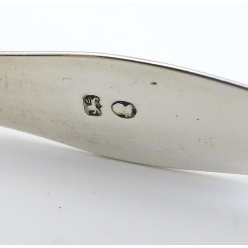 201 - Geo III silver sugar tongs with bright cut decoration. Maker Hester Bateman. Late 18thC . Approx 5 1... 