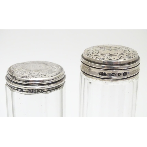 207 - Two Victorian silver lidded glass vanity bottles. Hallmarked Birmingham 1897 maker William Amaziah E... 