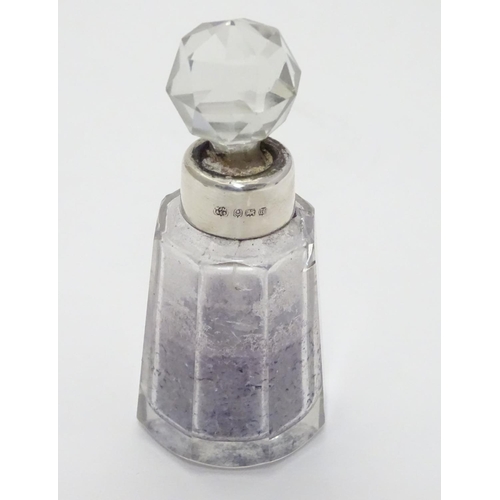 212 - A cut glass scent bottle with silver collar hallmarked Birmingham 1932 maker W J Myatt & Co 3 1/4