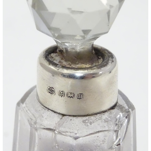 212 - A cut glass scent bottle with silver collar hallmarked Birmingham 1932 maker W J Myatt & Co 3 1/4