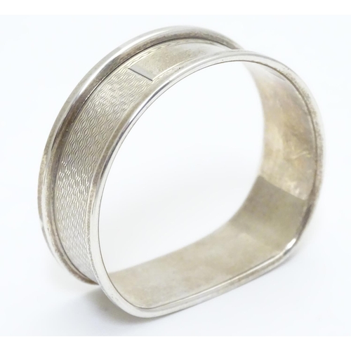 277 - A silver napkin ring with engine turned decoration hallmarked Birmingham 1988 maker B& Co.