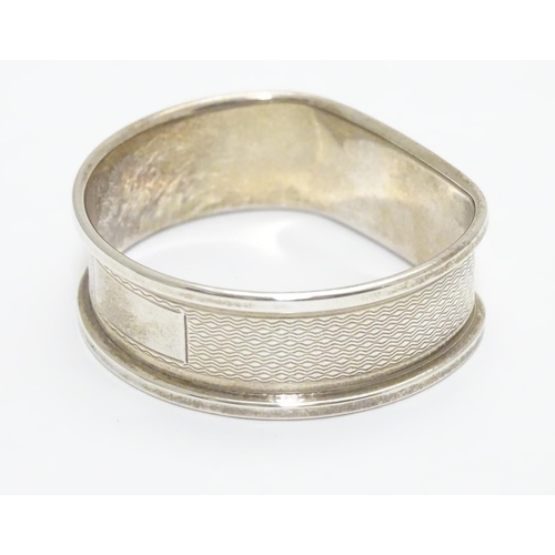 277 - A silver napkin ring with engine turned decoration hallmarked Birmingham 1988 maker B& Co.