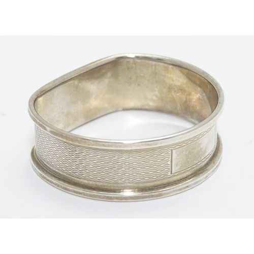 277 - A silver napkin ring with engine turned decoration hallmarked Birmingham 1988 maker B& Co.