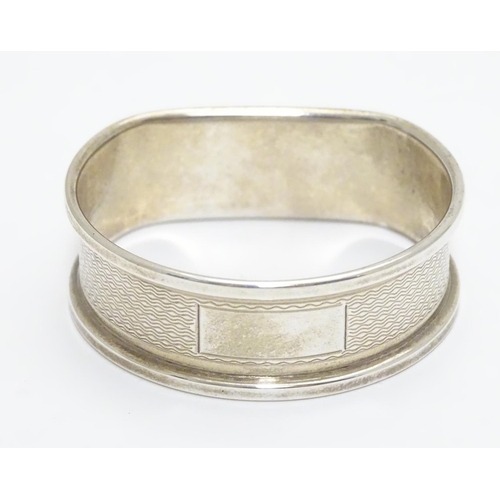 277 - A silver napkin ring with engine turned decoration hallmarked Birmingham 1988 maker B& Co.