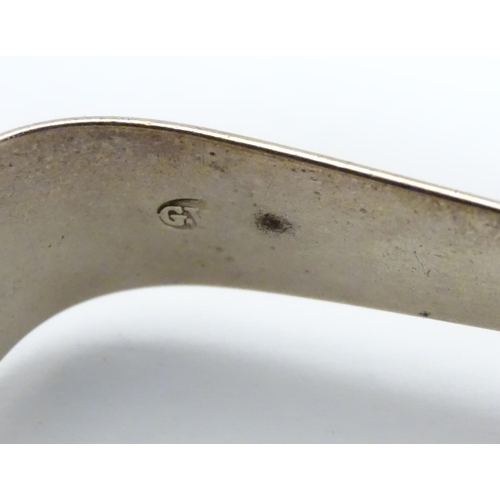 297 - Geo III silver sugar tongs with bright cut decoration hallmarked London 1791 maker GW. 5 1/4