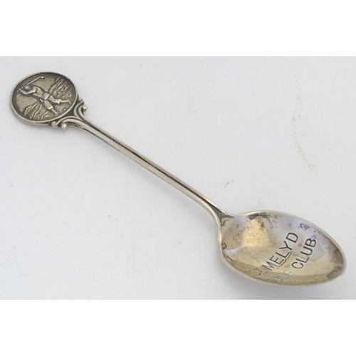 298 - A silver spoon the handle surmounted by image of a golfer and the bowl engraved St. Melyd Golf Club.... 