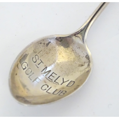 298 - A silver spoon the handle surmounted by image of a golfer and the bowl engraved St. Melyd Golf Club.... 