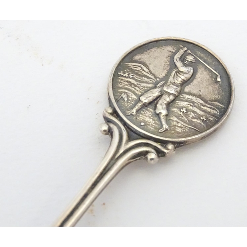 298 - A silver spoon the handle surmounted by image of a golfer and the bowl engraved St. Melyd Golf Club.... 