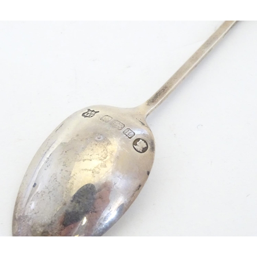 298 - A silver spoon the handle surmounted by image of a golfer and the bowl engraved St. Melyd Golf Club.... 