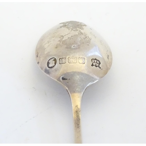 298 - A silver spoon the handle surmounted by image of a golfer and the bowl engraved St. Melyd Golf Club.... 