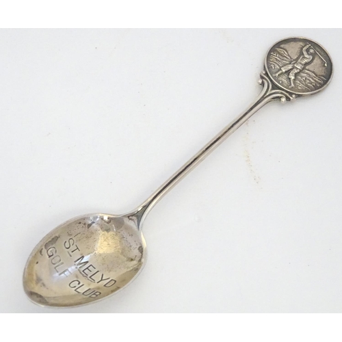 298 - A silver spoon the handle surmounted by image of a golfer and the bowl engraved St. Melyd Golf Club.... 