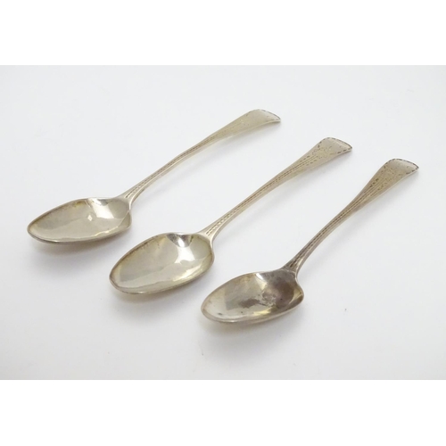 321 - A set of three William IV silver teaspoons with bright cut decoration to handles. Hallmarked 1832 ma... 