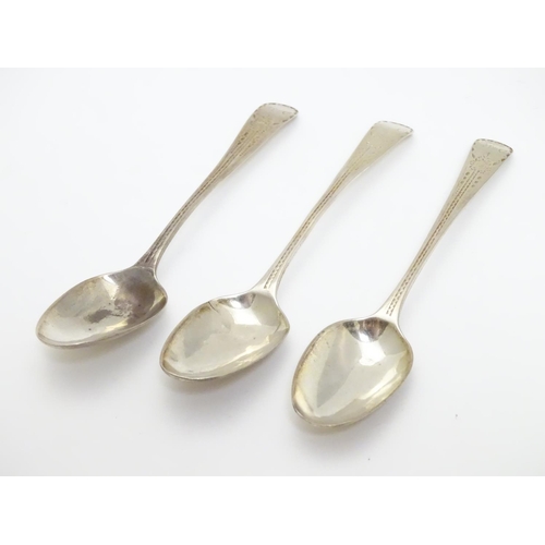 321 - A set of three William IV silver teaspoons with bright cut decoration to handles. Hallmarked 1832 ma... 