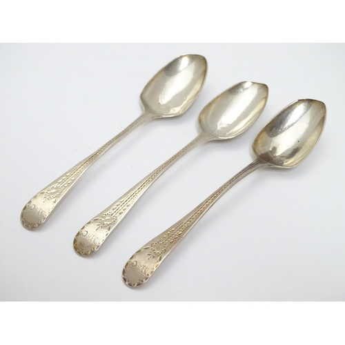 321 - A set of three William IV silver teaspoons with bright cut decoration to handles. Hallmarked 1832 ma... 