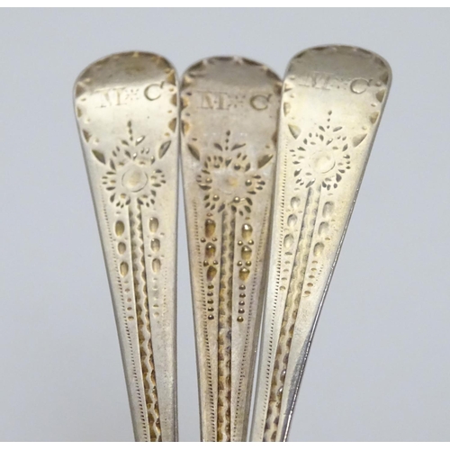 321 - A set of three William IV silver teaspoons with bright cut decoration to handles. Hallmarked 1832 ma... 