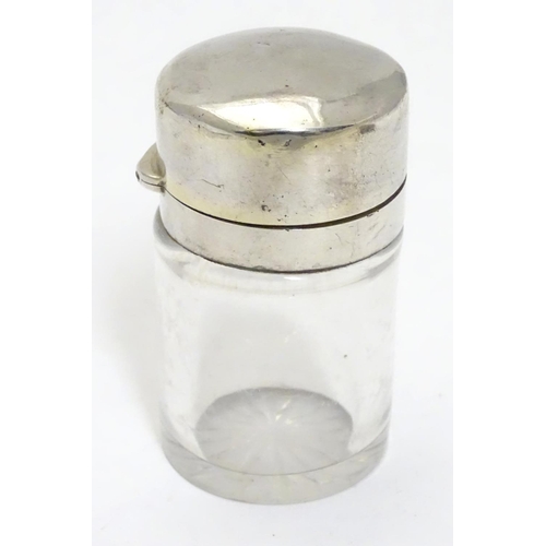 327 - A Victorian glass scent/salts bottle with stopper and silver hinged lid.  Hallmarked London 1886 mak... 