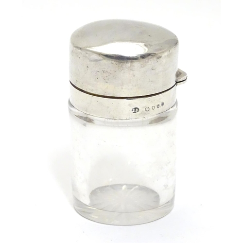 327 - A Victorian glass scent/salts bottle with stopper and silver hinged lid.  Hallmarked London 1886 mak... 