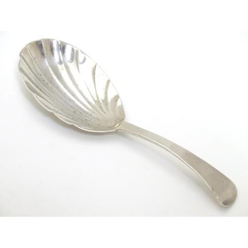 330 - A 19thC silver shell formed caddy spoon. Hallmarked London 1820 maker Thomas Wilkes
Barker. 4