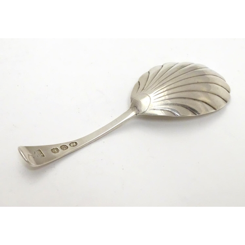 330 - A 19thC silver shell formed caddy spoon. Hallmarked London 1820 maker Thomas Wilkes
Barker. 4