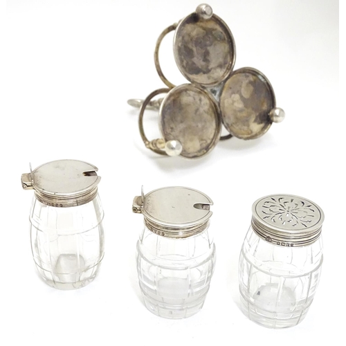 332 - A Victorian silver cruet stand with three glass bottles of barrel form with silver mounts. Hallmarke... 