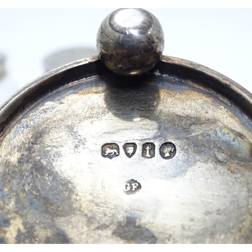 332 - A Victorian silver cruet stand with three glass bottles of barrel form with silver mounts. Hallmarke... 