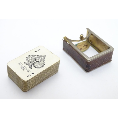 375 - A miniature deck of playing cards contained within a silver plate and leather case. Approx 1 3/4