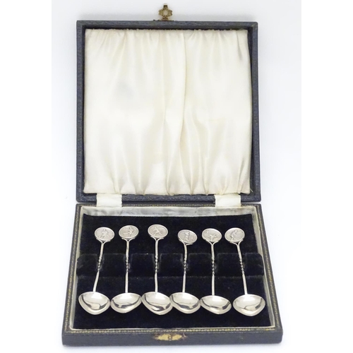 430 - A set of 6 silver spoons the handles surmounted by roundels depicting various sporting activities in... 