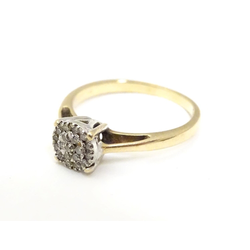 454 - A 9ct gold ring set with a profusion of diamonds. Ring size approx. I