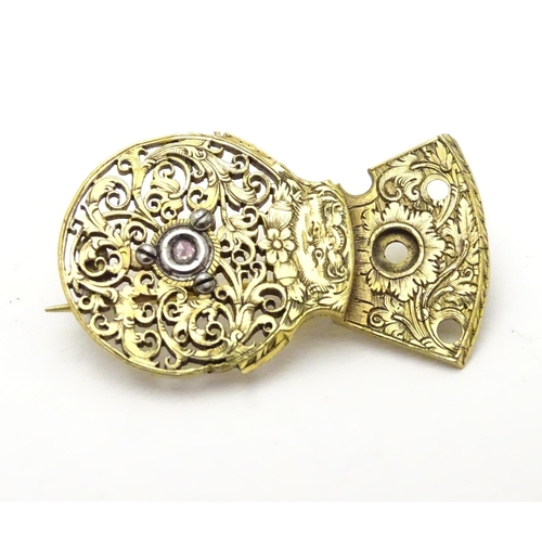 467 - A gilt metal brooch formed from a verge pocket watch balance cock, set with diamond to centre. Appro... 