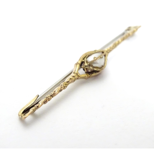 489 - A yellow metal bar brooch set with central pearl  2