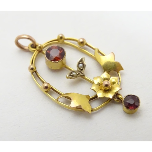 491 - An Art Nouveau pendant  set with garnets and seed pearls. Approx 1 1/4