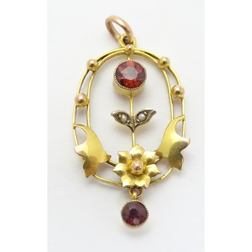 491 - An Art Nouveau pendant  set with garnets and seed pearls. Approx 1 1/4