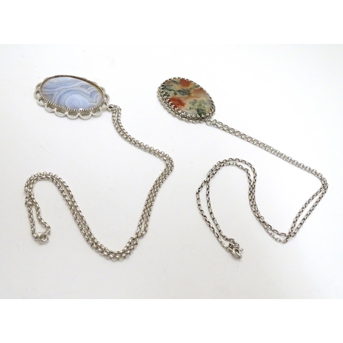 506 - Two silver pendants and chains each set with agate cabochons, one moss agate. Each pendant approx 2