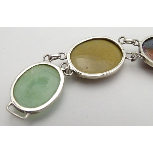 506 - Two silver pendants and chains each set with agate cabochons, one moss agate. Each pendant approx 2