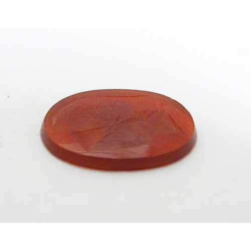 523 - A carnelian intaglio seal unmounted depicting head of a Greco Roman warrior. Approx. 1/2