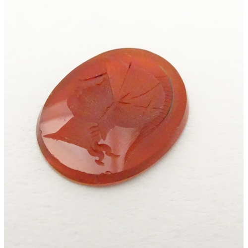 523 - A carnelian intaglio seal unmounted depicting head of a Greco Roman warrior. Approx. 1/2