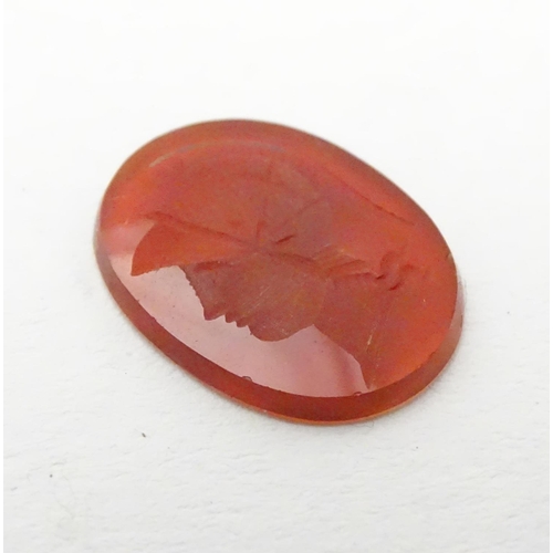 523 - A carnelian intaglio seal unmounted depicting head of a Greco Roman warrior. Approx. 1/2