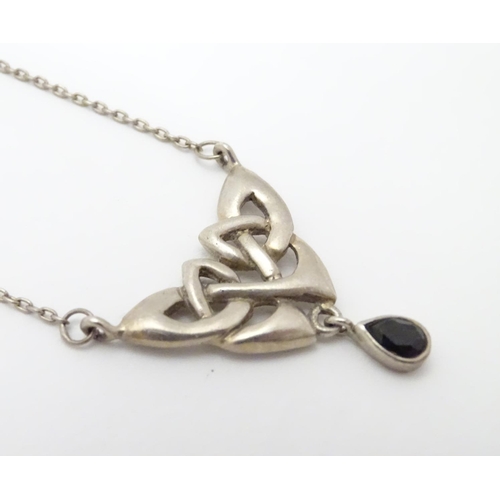 526 - A silver pendant and chain necklace with Celtic style decoration approx 16