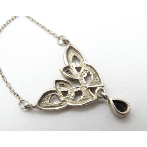 526 - A silver pendant and chain necklace with Celtic style decoration approx 16