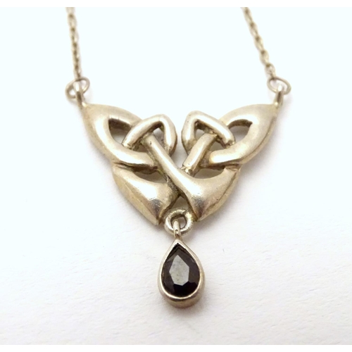 526 - A silver pendant and chain necklace with Celtic style decoration approx 16