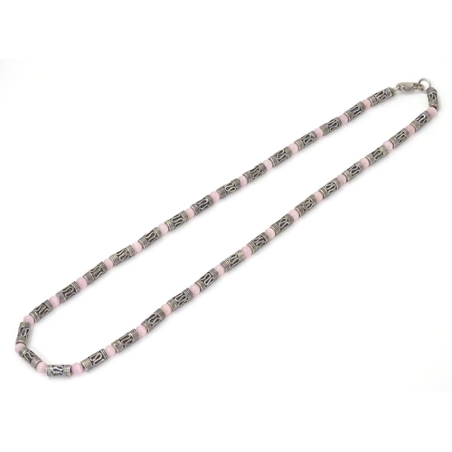 535 - A silver and white metal necklace set with pink cats eye beads. Approx 16'' long