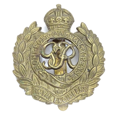 572 - Militaria : a mid-20thC brass Royal Engineers cap badge and lapel badge, the largest 1 5/8