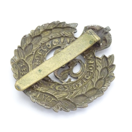 572 - Militaria : a mid-20thC brass Royal Engineers cap badge and lapel badge, the largest 1 5/8