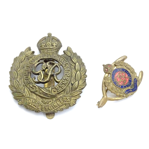 572 - Militaria : a mid-20thC brass Royal Engineers cap badge and lapel badge, the largest 1 5/8