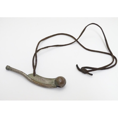 574 - Militaria : an early to mid 20thC Bosun's whistle, with leather lanyard, 4 1/2