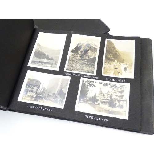 668 - A pre-war photograph album, containing monochrome photographs titled and dated 1929-1937, locations ... 