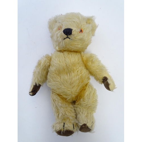 695 - Toy: A mohair teddy bear with articulated limbs, pad paws, stitched claws, and a proud, stitched nos... 